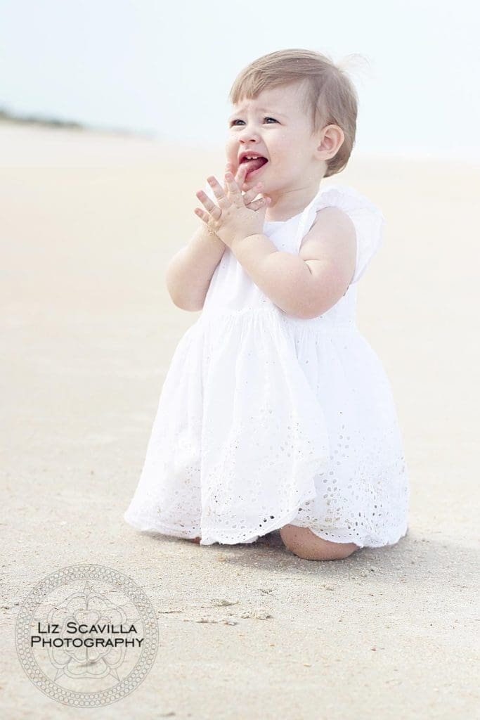 Baby Playing In The Sand