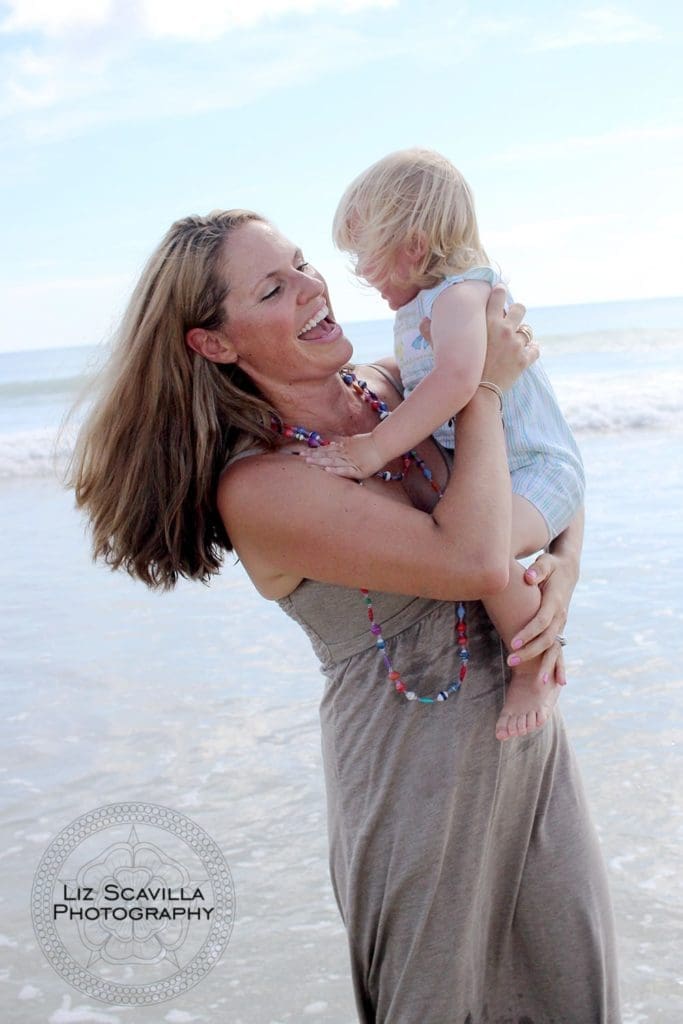 Mother Holding Son on Beach