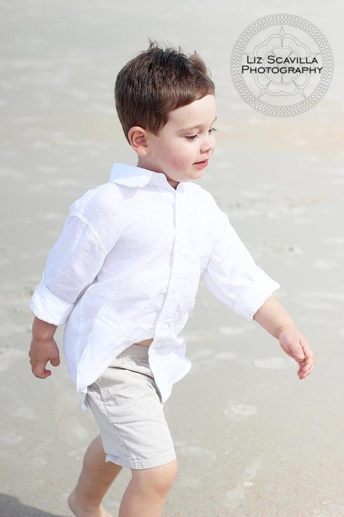 Boy Walking Along the Beach