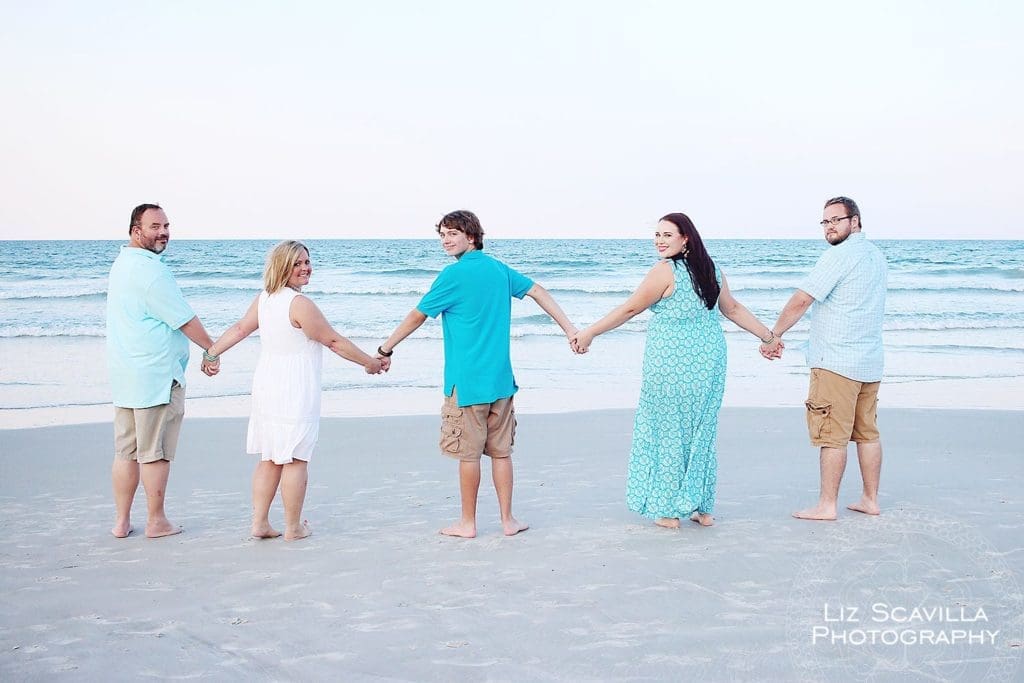 Family Holding Hands on the Beach