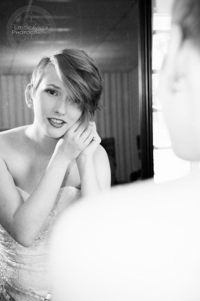 Bridesmaid looking in mirror