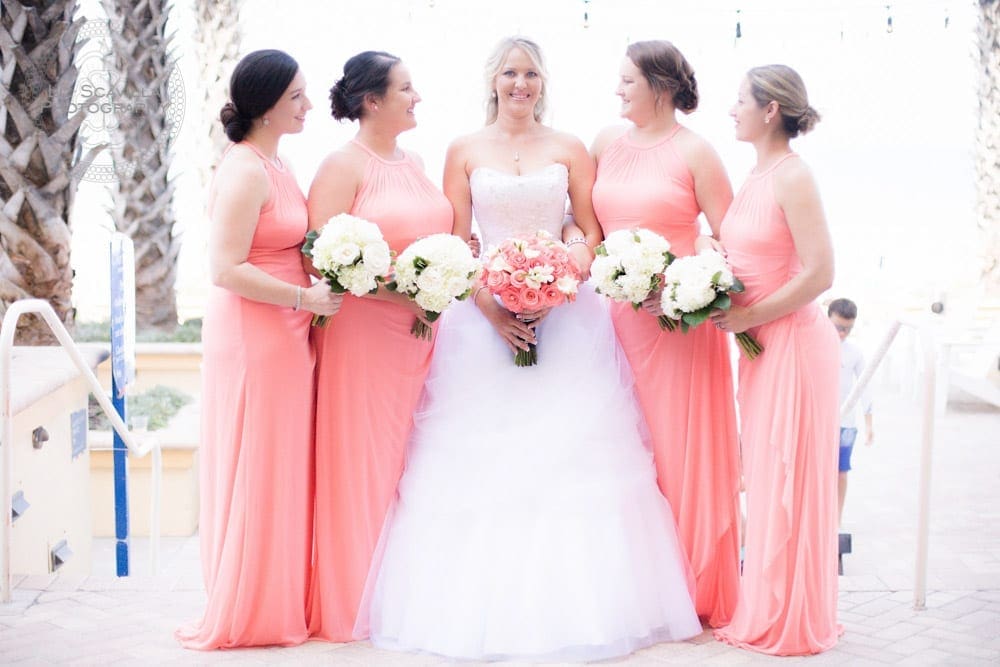 Bridesmaids Looking at Bride