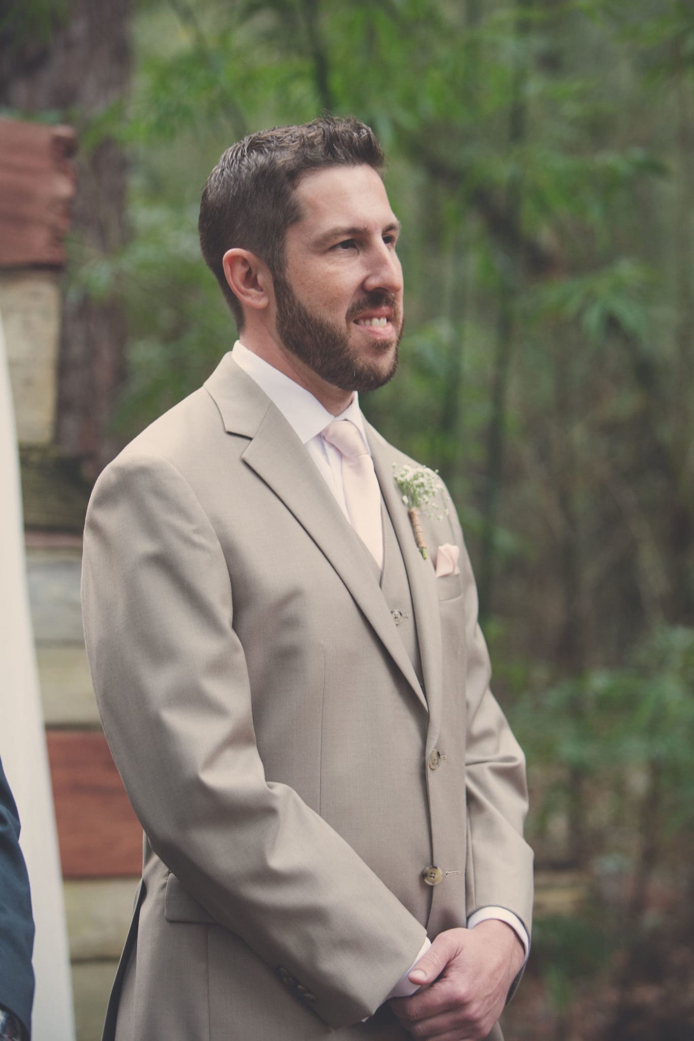 The groom waiting for his bride to walk down the aisle.