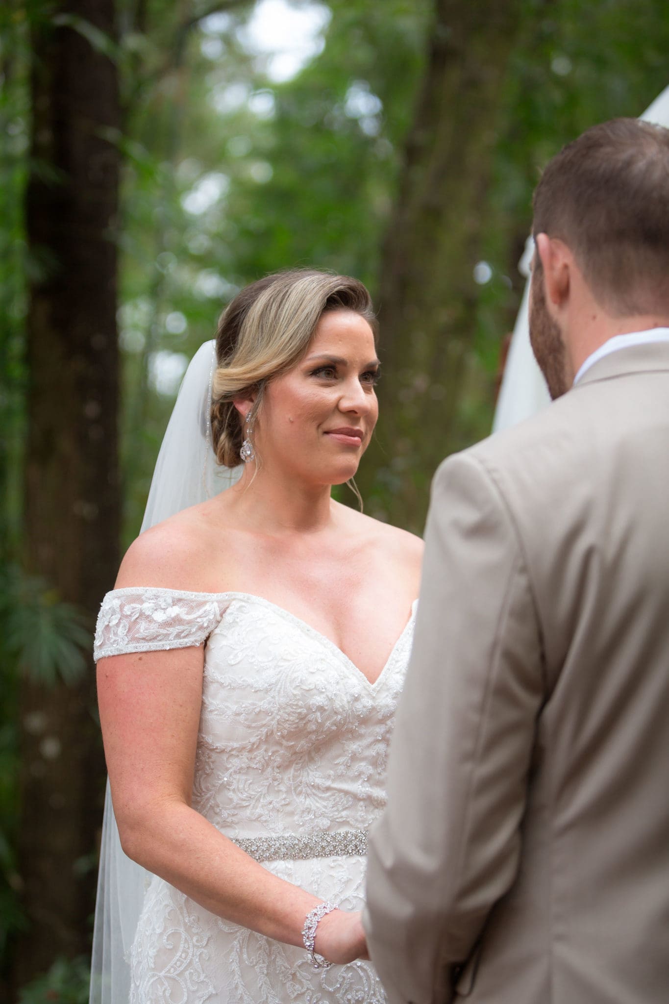 Bride looking at her groom during the ceremony.