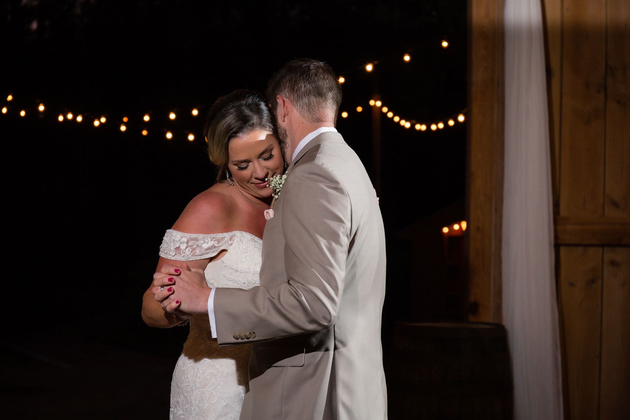 A sweet moment captured during their first dance.