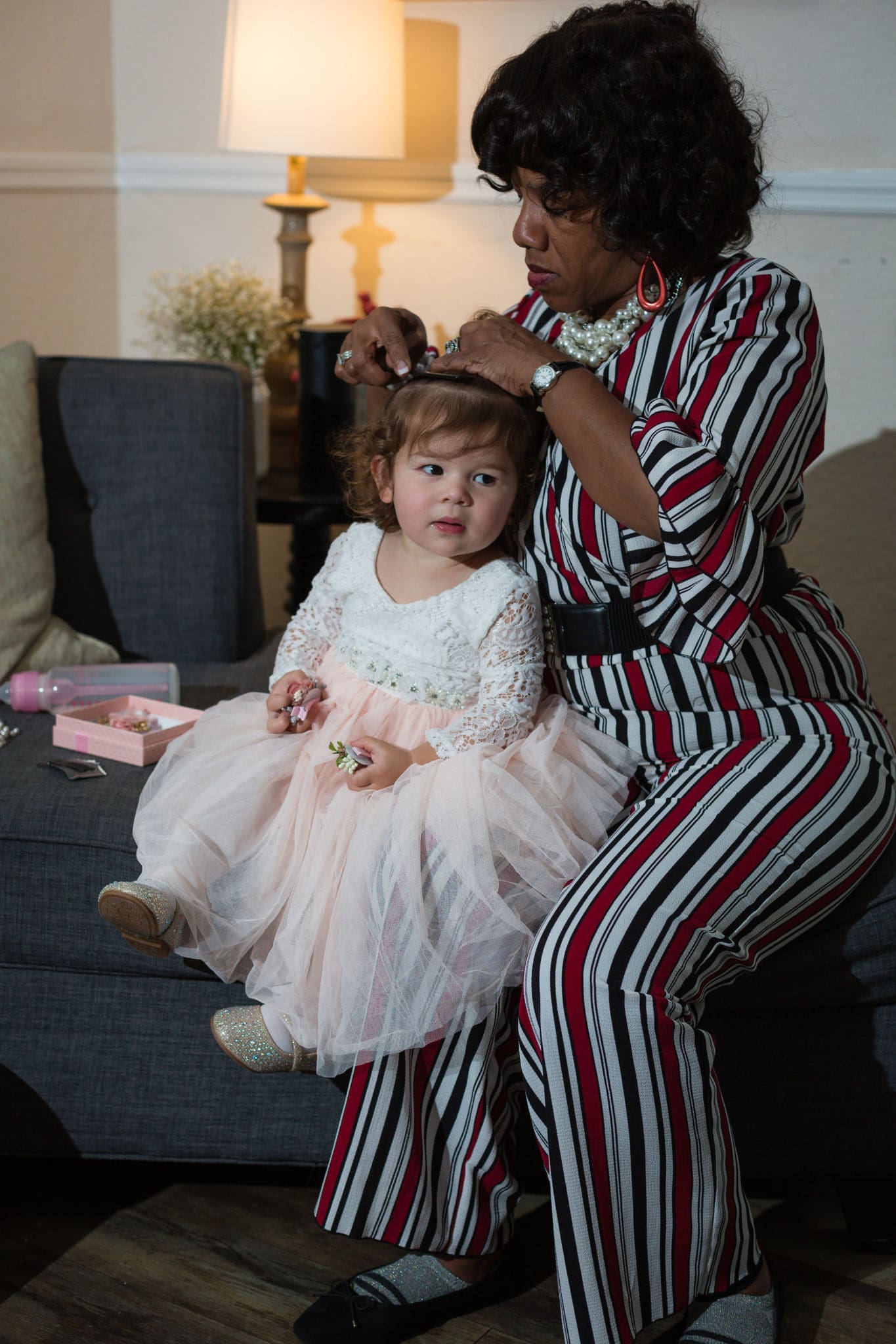 The bride and groom's daughter getting her hair done. So precious!