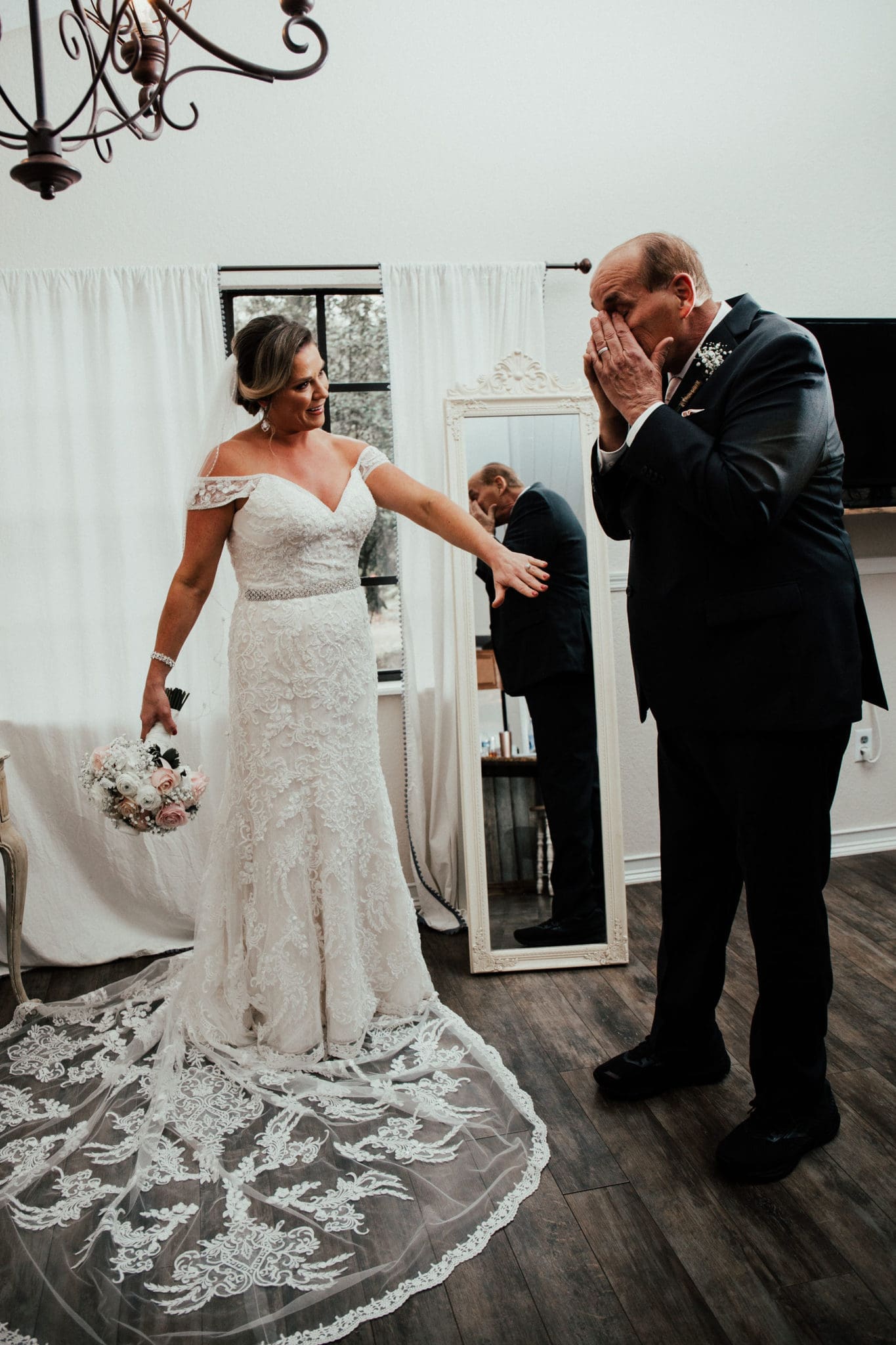 An emotional first look with the father of the bride.