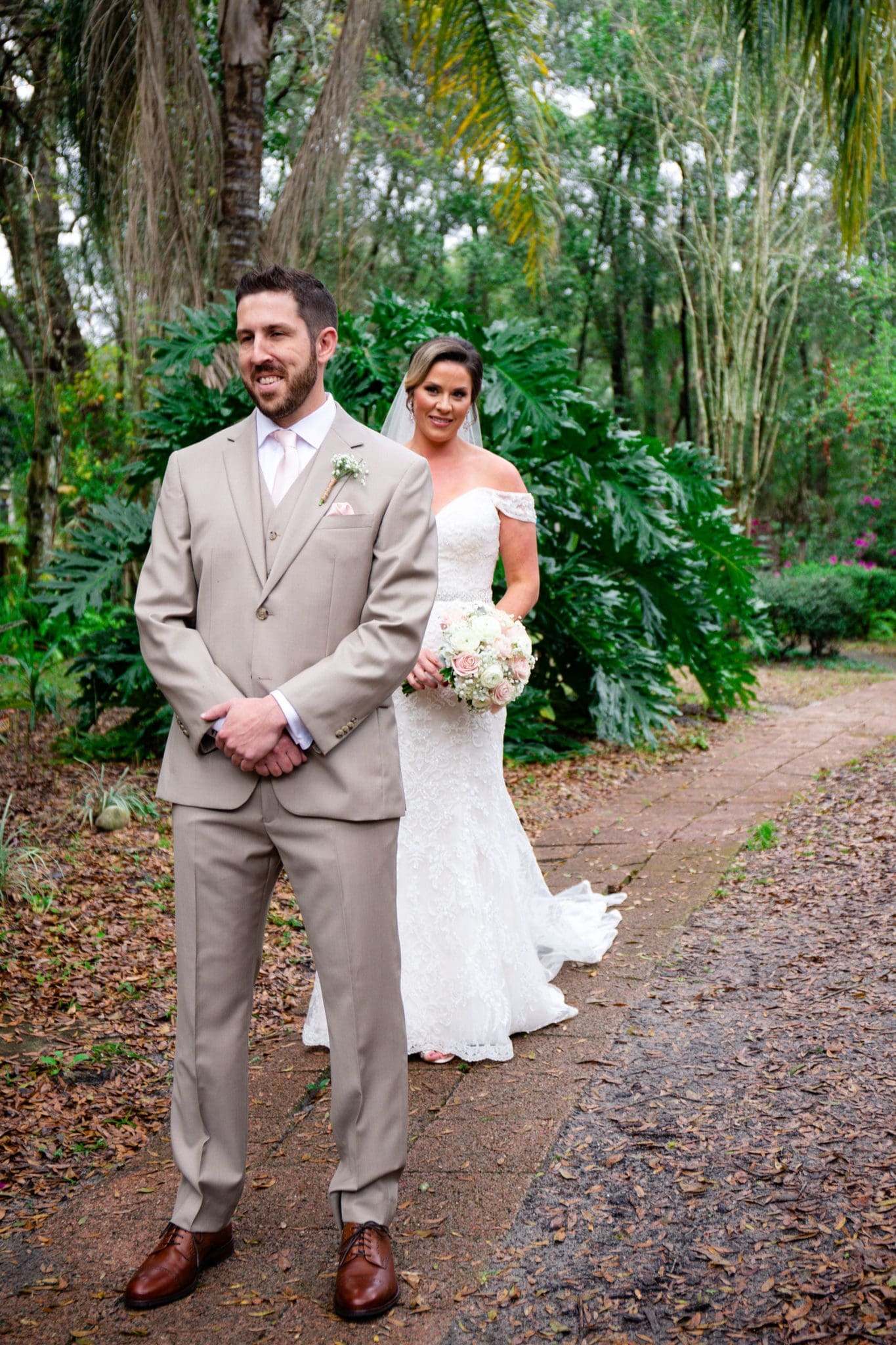 The bride sneaking up behind the groom for their first look.