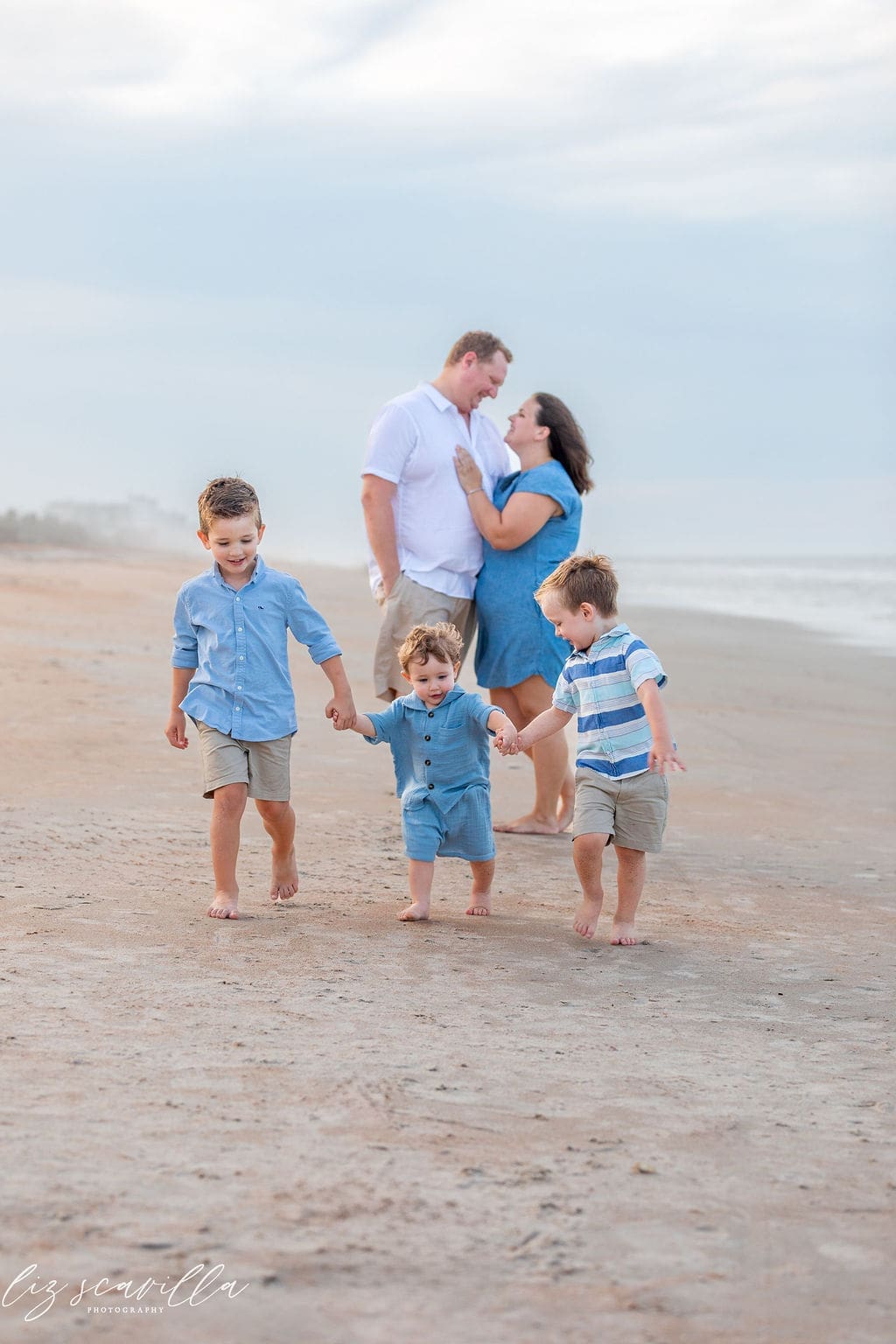 family photo outfit ideas for beach family photos in blue tones