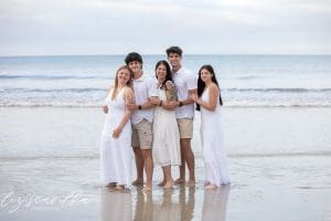 family portrait near ocean waves