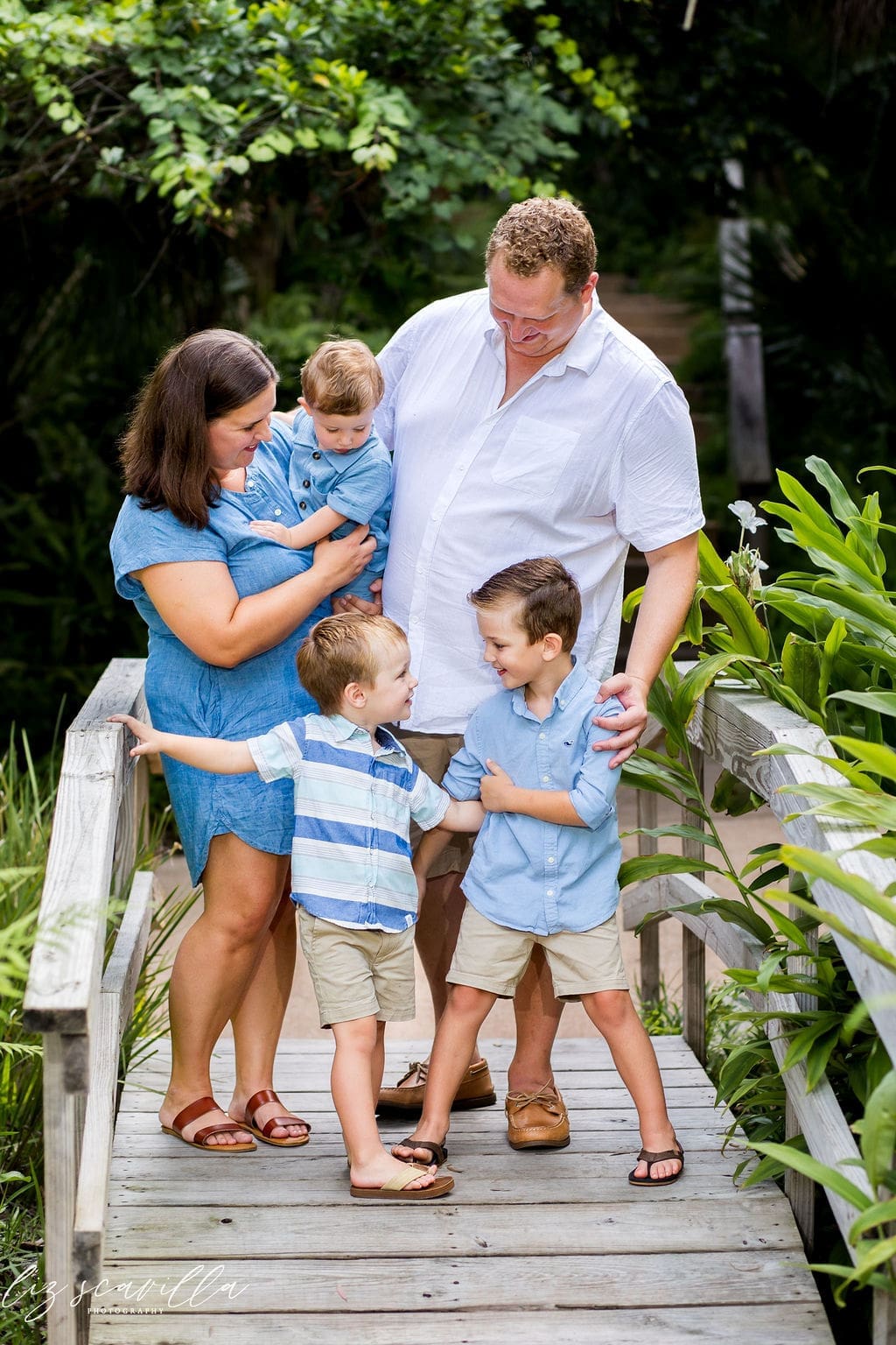 family photo outfit ideas for riverfront family session in blue and white outfits